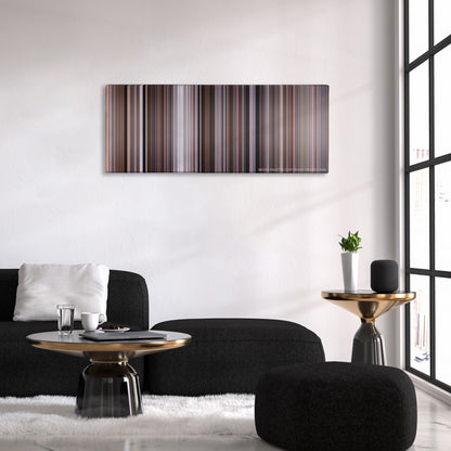The Good, the Bad and the Ugly color palette canvas above a black sofa with a gold-topped table