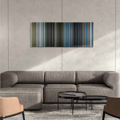Project X color palette canvas on a concrete wall above a gray sectional sofa