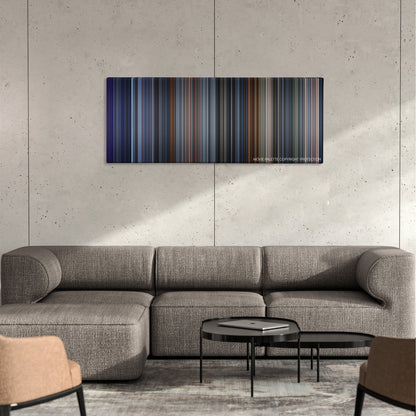 The One color palette canvas on a concrete wall above a gray sectional sofa