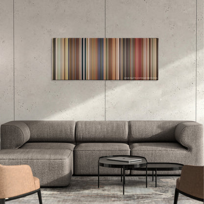 Bedtime Stories color palette canvas on a concrete wall above a gray sectional sofa