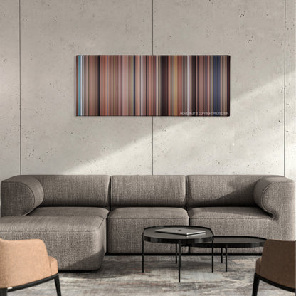 The Pacifier color palette canvas on a concrete wall above a gray sectional sofa
