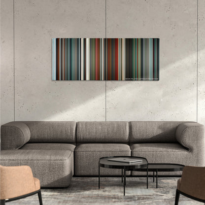 Hanna color palette canvas on a concrete wall above a gray sectional sofa