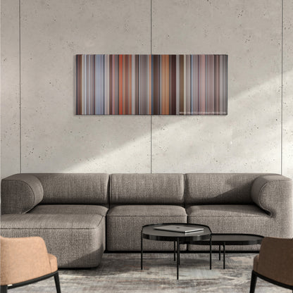Primal Fear color palette canvas on a concrete wall above a gray sectional sofa