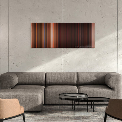 From Dusk Till Dawn color palette canvas on a concrete wall above a gray sectional sofa