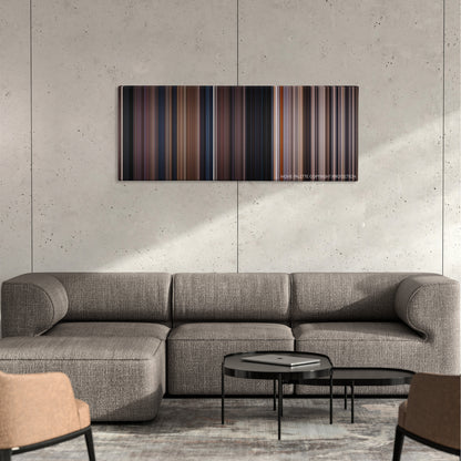 Blood Simple color palette canvas on a concrete wall above a gray sectional sofa