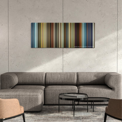 3 Days to Kill color palette canvas on a concrete wall above a gray sectional sofa
