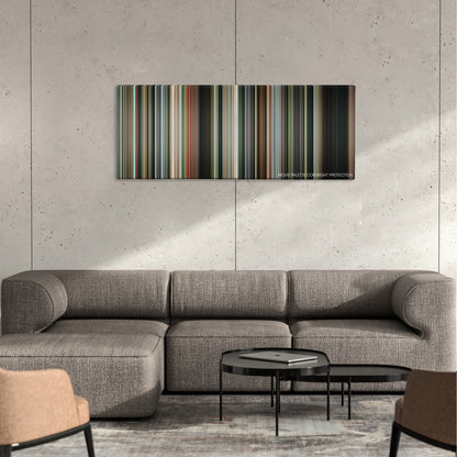 Widows color palette canvas on a concrete wall above a gray sectional sofa