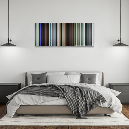Chronicle color palette canvas above a bed, between two black pendant lamps
