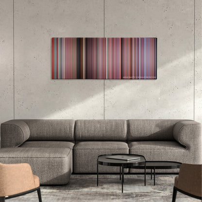 Bring It On color palette canvas on a concrete wall above a gray sectional sofa