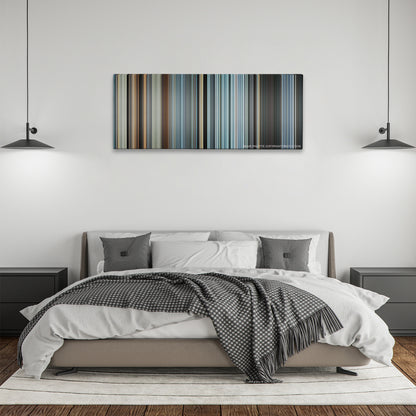 Sully color palette canvas above a bed, between two black pendant lamps