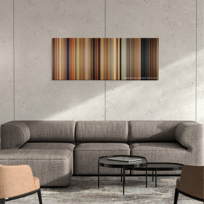 Killers color palette canvas on a concrete wall above a gray sectional sofa