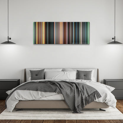 Blow color palette canvas above a bed, between two black pendant lamps