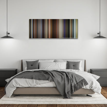 Spy color palette canvas above a bed, between two black pendant lamps