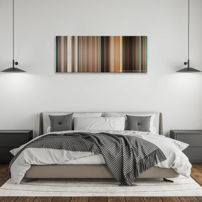 The Bucket List color palette canvas above a bed, between two black pendant lamps