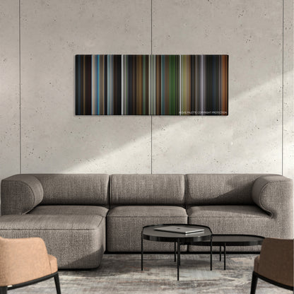 Elektra color palette canvas on a concrete wall above a gray sectional sofa