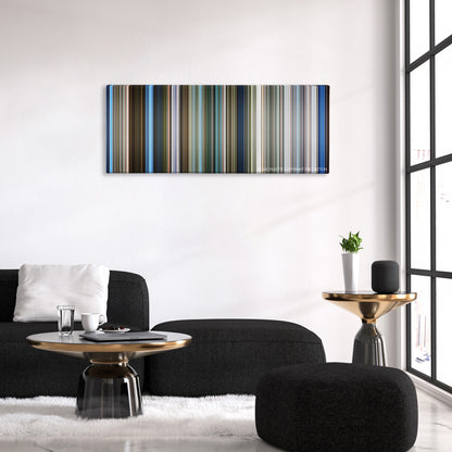 Skyline color palette canvas above a black sofa with a gold-topped table