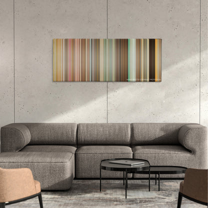Disaster Movie color palette canvas on a concrete wall above a gray sectional sofa