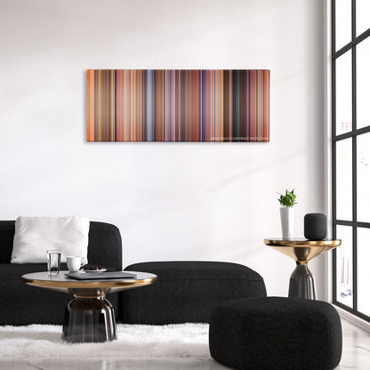 Ali G Indahouse color palette canvas above a black sofa with a gold-topped table