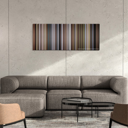 Nymphomaniac: Vol. II color palette canvas on a concrete wall above a gray sectional sofa