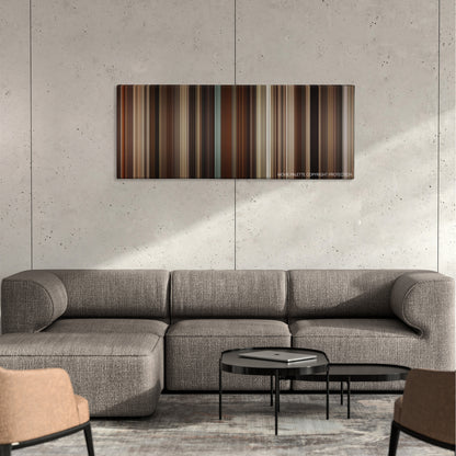 Selma color palette canvas on a concrete wall above a gray sectional sofa