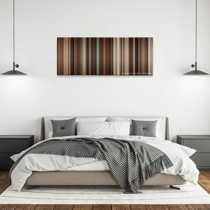 Selma color palette canvas above a bed, between two black pendant lamps