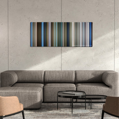 Skyline color palette canvas on a concrete wall above a gray sectional sofa
