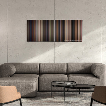 Cop Land color palette canvas on a concrete wall above a gray sectional sofa