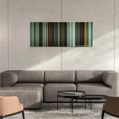Shame color palette canvas on a concrete wall above a gray sectional sofa