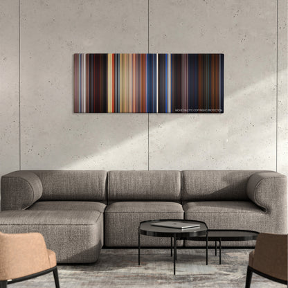 Out of Sight color palette canvas on a concrete wall above a gray sectional sofa