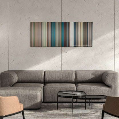 Blue Valentine color palette canvas on a concrete wall above a gray sectional sofa