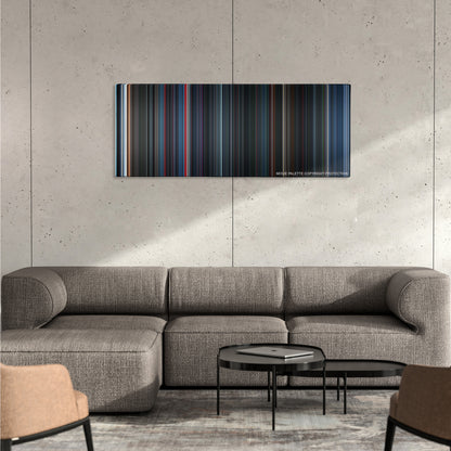 Alien vs. Predator color palette canvas on a concrete wall above a gray sectional sofa