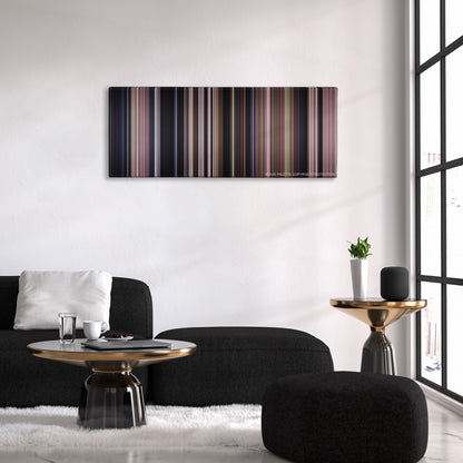 Monster color palette canvas above a black sofa with a gold-topped table