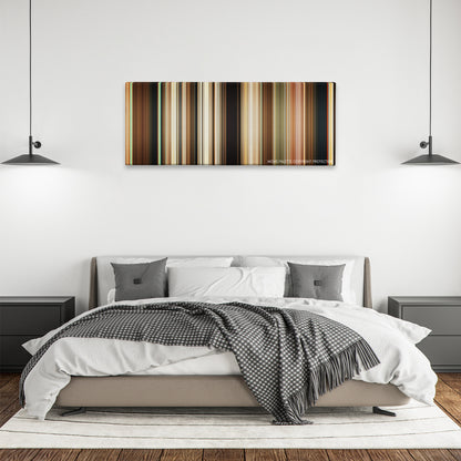 Palm Springs color palette canvas above a bed, between two black pendant lamps