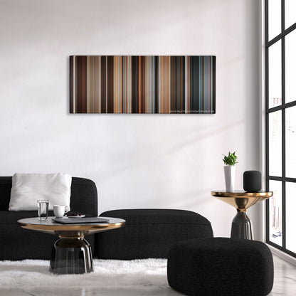 Los Idus de Marzo color palette canvas above a black sofa with a gold-topped table
