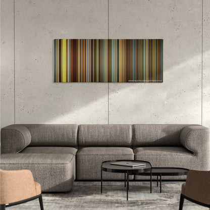 Side Effects color palette canvas on a concrete wall above a gray sectional sofa