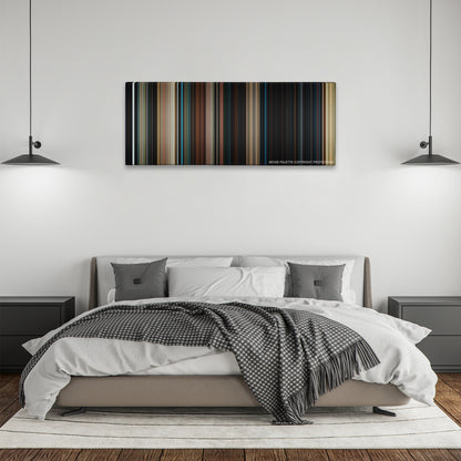 I Am Number Four color palette canvas above a bed, between two black pendant lamps