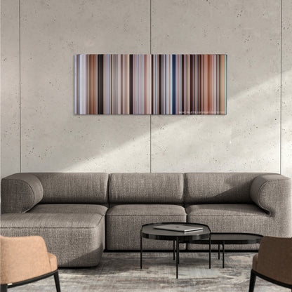 Waterworld color palette canvas on a concrete wall above a gray sectional sofa