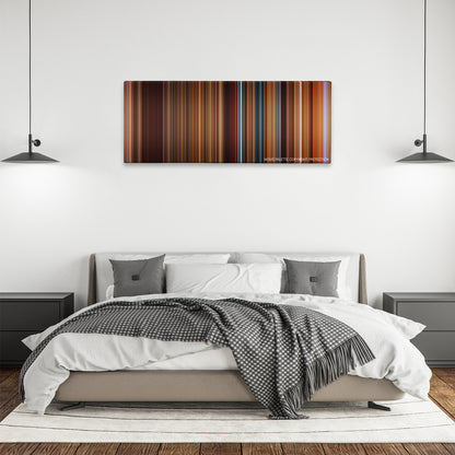 The Quick and the Dead color palette canvas above a bed, between two black pendant lamps