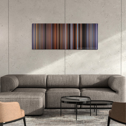 Submarine color palette canvas on a concrete wall above a gray sectional sofa