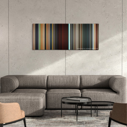 xXx: Return of Xander Cage color palette canvas on a concrete wall above a gray sectional sofa