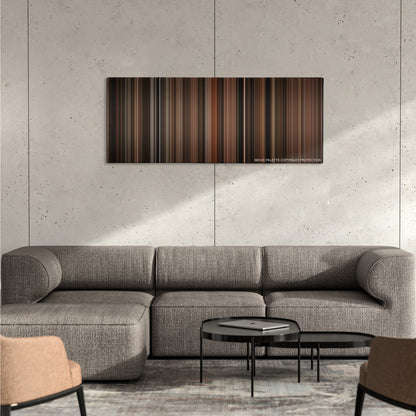 Cinderella Man color palette canvas on a concrete wall above a gray sectional sofa