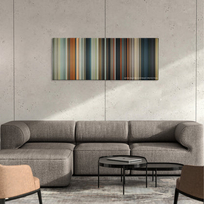 Cop Out color palette canvas on a concrete wall above a gray sectional sofa