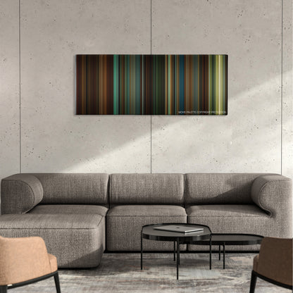 We Own the Night color palette canvas on a concrete wall above a gray sectional sofa