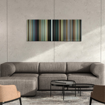 The Circle color palette canvas on a concrete wall above a gray sectional sofa