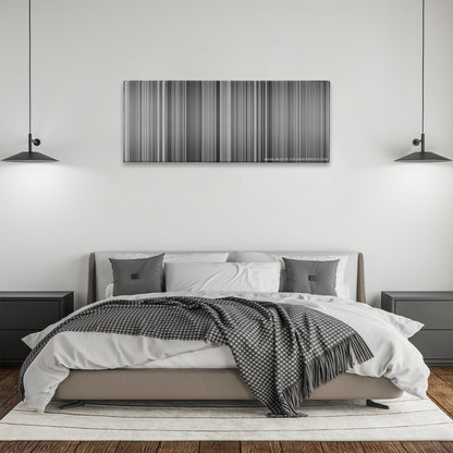 Modern Times color palette canvas above a bed, between two black pendant lamps