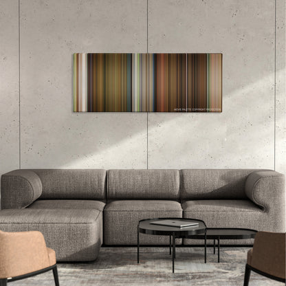 Knock Knock color palette canvas on a concrete wall above a gray sectional sofa