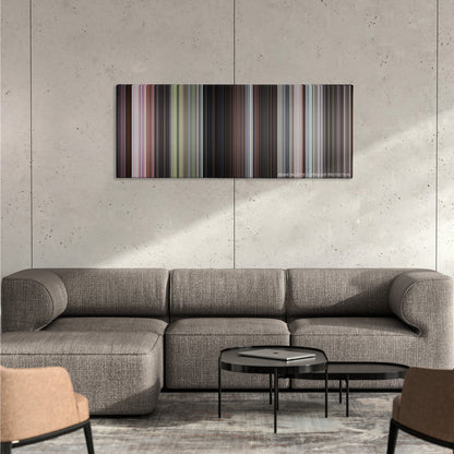 Goldfinger color palette canvas on a concrete wall above a gray sectional sofa