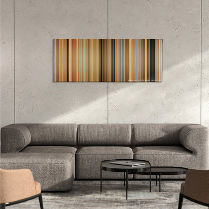 Erin Brockovich color palette canvas on a concrete wall above a gray sectional sofa