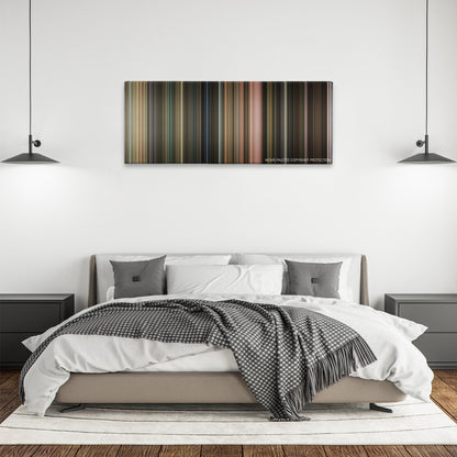 Flubber color palette canvas above a bed, between two black pendant lamps