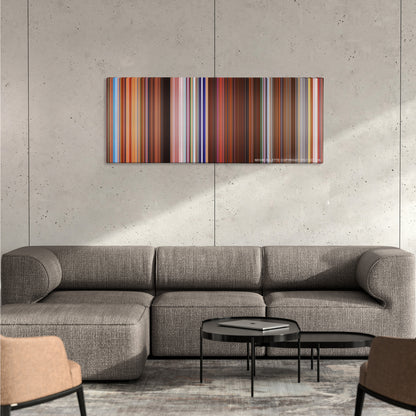 Charlie's Angels color palette canvas on a concrete wall above a gray sectional sofa